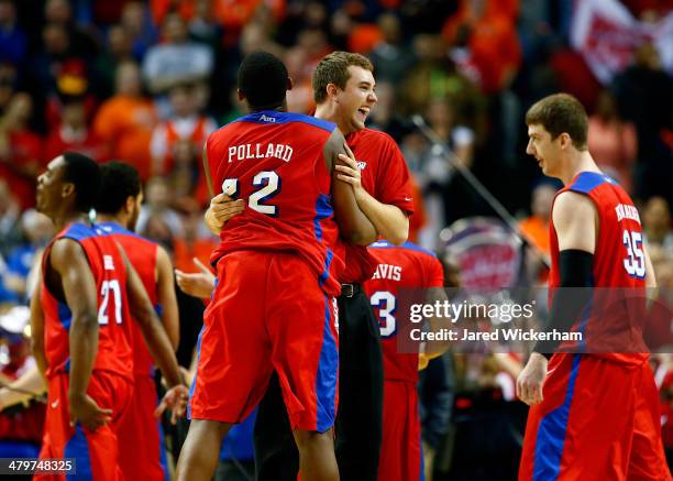 Kendall Pollard of the Dayton Flyers celebrates after defeating the Ohio State Buckeyes 60-59 in the second round of the 2014 NCAA Men's Basketball...