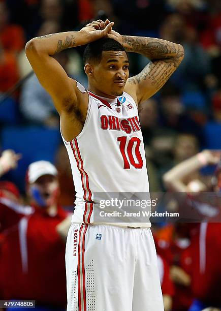 LaQuinton Ross of the Ohio State Buckeyes reacts after fouling Devin Oliver of the Dayton Flyers during the second round of the 2014 NCAA Men's...