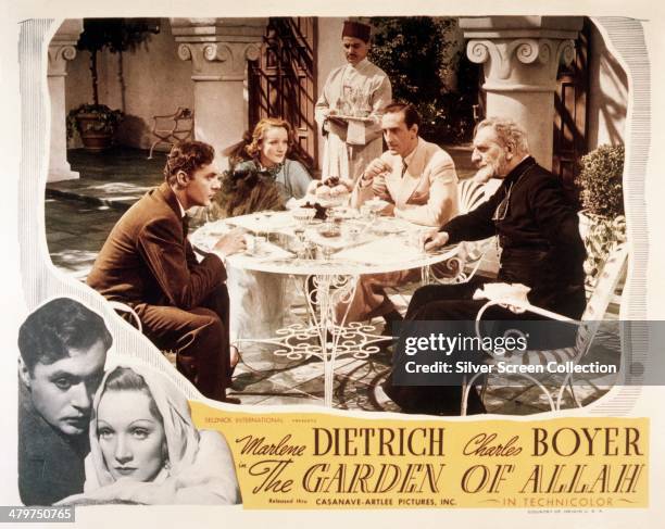 Lobby card for 'The Garden Of Allah', directed by Richard Boleslawski, 1936. Sitting around the table are Charles Boyer, Marlene Dietrich, Basil...