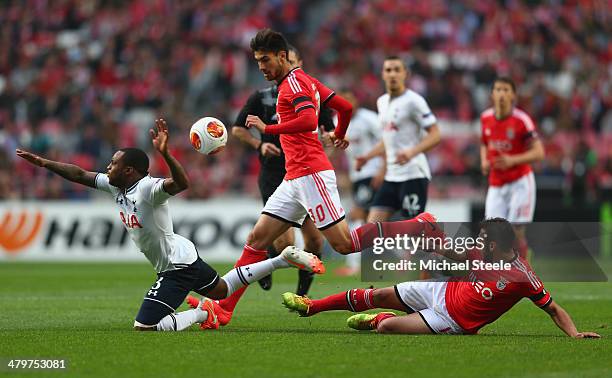 Danny Rose of Tottenham Hotspur is fouled by Eduardo Salvio of SL Benfica as Andre Gomes looks on during the UEFA Europa League Round of 16 2nd leg...