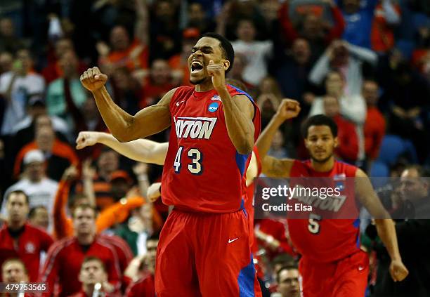 Vee Sanford of the Dayton Flyers reacts after defeating the Ohio State Buckeyes 60-59 in the second round of the 2014 NCAA Men's Basketball...