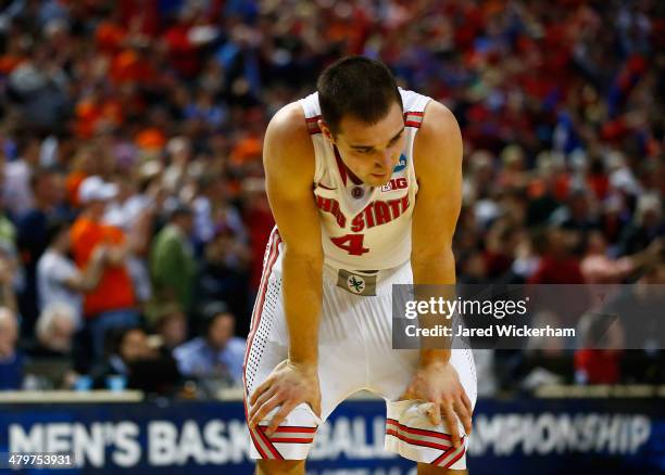 Aaron Craft of the Ohio State Buckeyes reacts after losing to the Dayton Flyers 60-59 in the second round of the 2014 NCAA Men's Basketball...