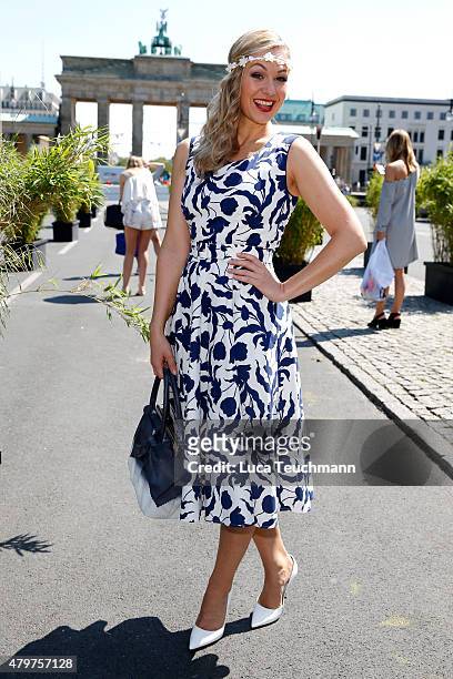 Ruth Moschner attends the Lena Hoschek show during the Mercedes-Benz Fashion Week Berlin Spring/Summer 2016 at Brandenburg Gate on July 7, 2015 in...
