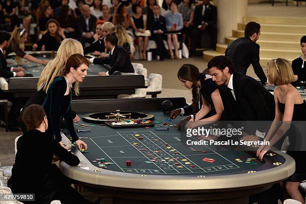 Kristen Stewart, Julianne Moore, Lara Stone, Tugba Sungoruglu, Baptiste Giabiconi and Lily Rose Depp attend the Chanel show as part of Paris Fashion...