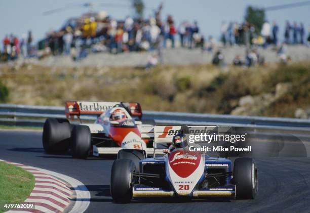 Stefan Johansson of Sweden drives the Toleman Group Motorsport Toleman TG184 Hart Straight-4 turbo ahead of Niki Lauda during the Portuguese Grand...