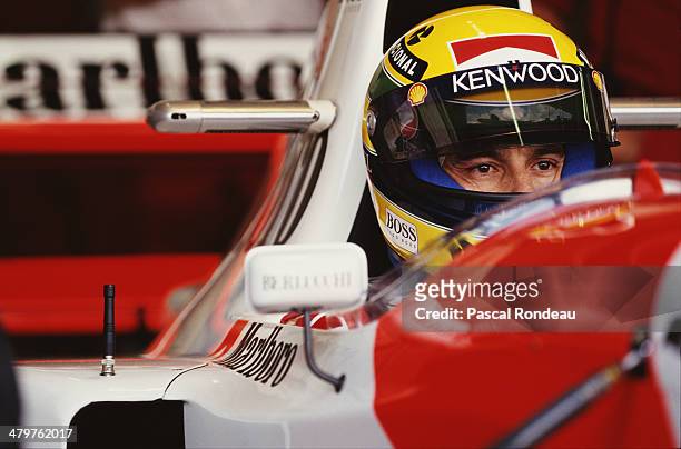 Ayrton Senna of Brazil sits aboard the Marlboro McLaren McLaren MP4/8 Ford HBE7 V10 during practice for the Fuji Television Japanese Grand Prix on...