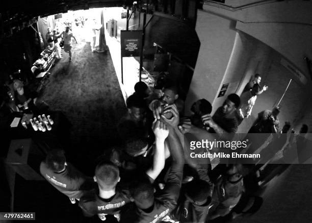 The Florida Gators huddle inside the tunnel before taking on the Albany Great Danes during the second round of the 2014 NCAA Men's Basketball...