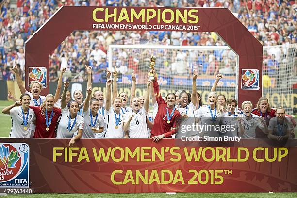 Women's World Cup Final: USA goalie Hope Solo victorious with trophy and teammates after winning game vs Japan at BC Place. Vancouver, Canada...