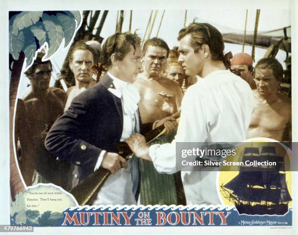 Lobby card for Frank Lloyd's 1935 historical drama 'Mutiny On The Bounty', featuring Franchot Tone as Byam, and Clark Gable as Fletcher Christian.