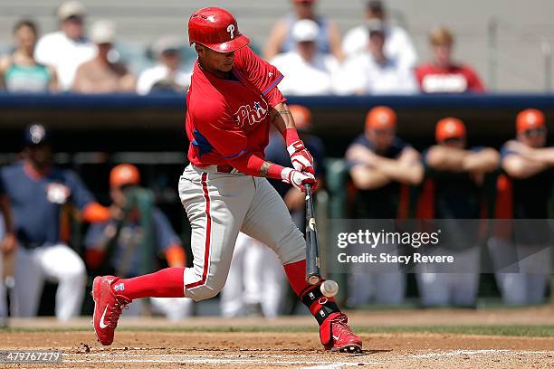 Ronny Cedeno of the Philadelphia Phillies swings at a pitch in the first inning of a game against the Houston Astros at Osceola County Stadium on...