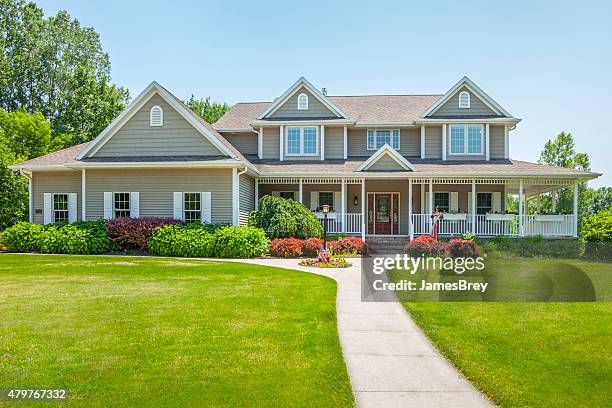 idyllic home with covered porch - buildings stock pictures, royalty-free photos & images