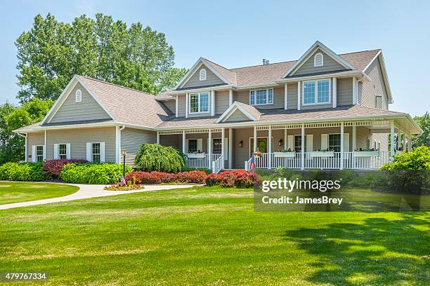 large, perfect, maintenance free home with covered porch - roofing stock pictures, royalty-free photos & images