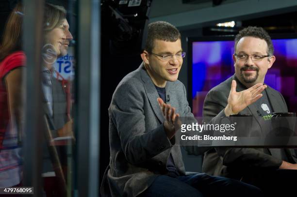 Max Levchin, co-founder of PayPal Inc. And chairman of Kaggle Inc., left, speaks as Phil Libin, chief executive officer of Evernote Corp., listens...