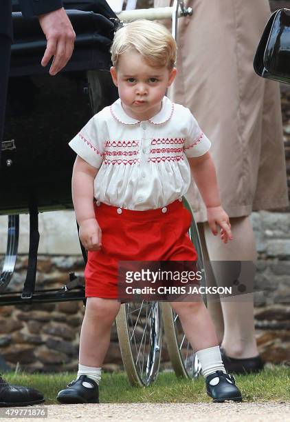 Prince George of Cambridge leaves his sister Charlotte's christening at St. Mary Magdalene Church in Sandringham, England, on July 5, 2015. Britain's...