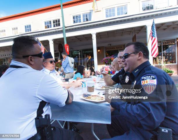 police officers eating pancakes, july 4, santa fe, nm - santa pancakes stock pictures, royalty-free photos & images