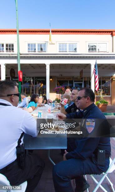police officers eating pancakes, july 4, santa fe, nm - santa pancakes stock pictures, royalty-free photos & images