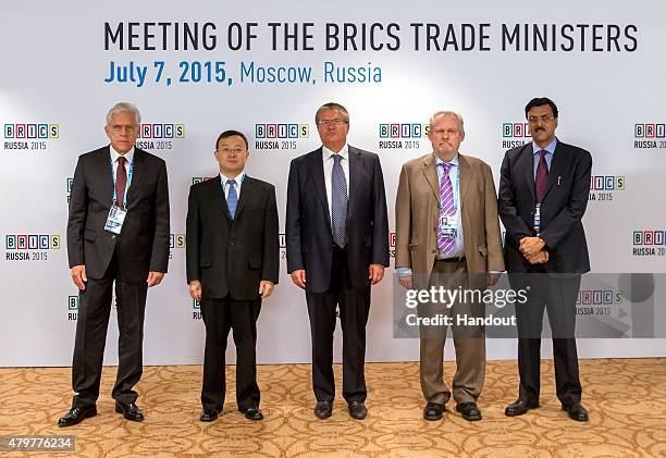 In this handout image supplied by Host Photo Agency / RIA Novosti, First Deputy Minister of Development, Industry and Foreign Trade of the Federative...