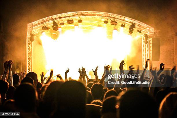 music festival - enthusiastic theater audience clapping stock pictures, royalty-free photos & images