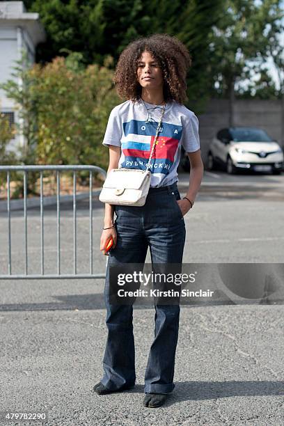 Nelly Chevaillier wears Gosha Rubchinskiy shirt, APC pants, Maison Martin Margiela shoes and Chanel bag on day 5 of Paris Fashion Week Menswear...