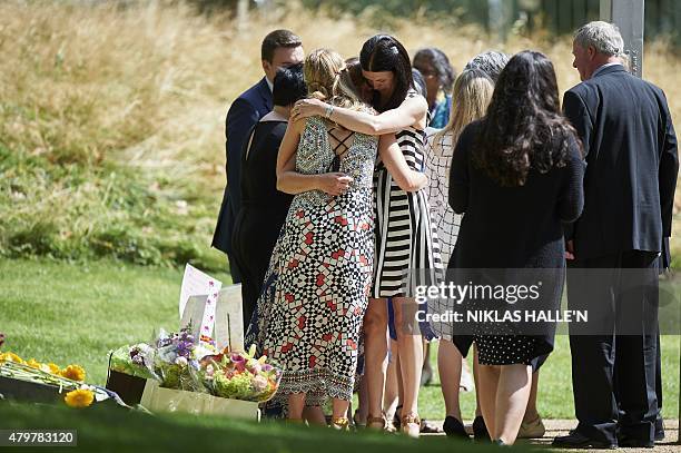 Survivors, friends and relatives of victims lay flowers at the 7/7 memorial in London's Hyde Park on July 7 in memory of the 52 people killed during...