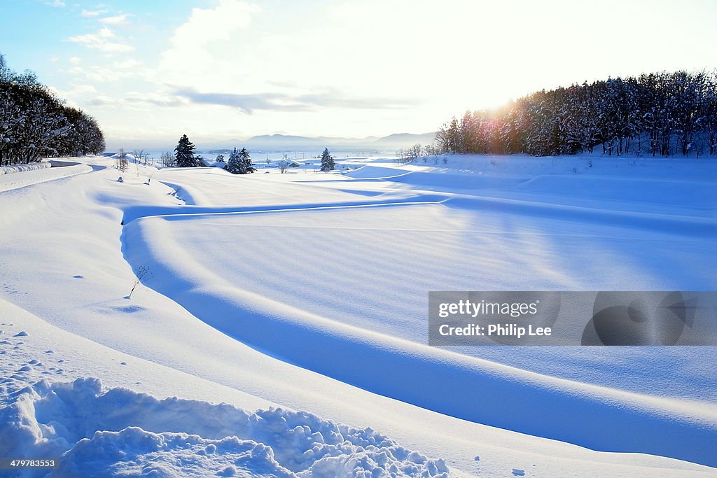 Snow white plain with beautiful sunset