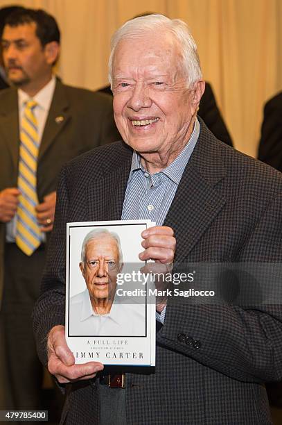 President Jimmy Carter signs copies of his book "Full Life: Reflections at Ninety" at Barnes & Noble, 5th Avenue on July 7, 2015 in New York City.