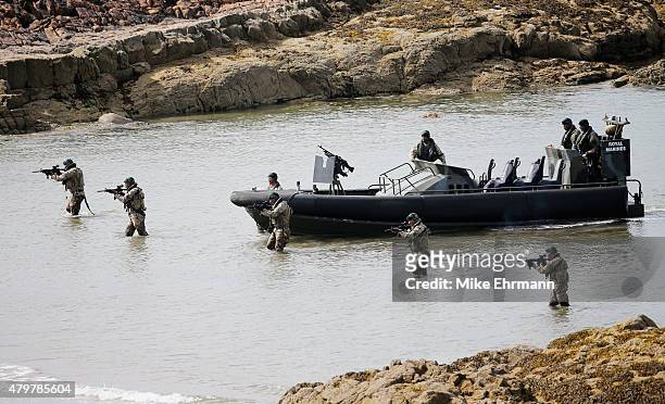 Troop of Royal Marines from the 43 Commando approach a beach via the Firth of Forth on an ORC to deliver the Scottish Open trophy for 'safe keeping'...