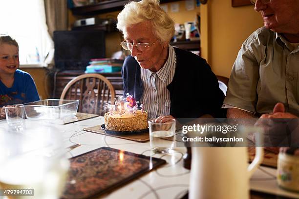 elderly woman celebrating her birthday - daily life in ireland stock-fotos und bilder