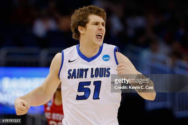 Rob Loe of the Saint Louis Billikens reacts after shooting a three point basket against the North Carolina State Wolfpack during the second round of...