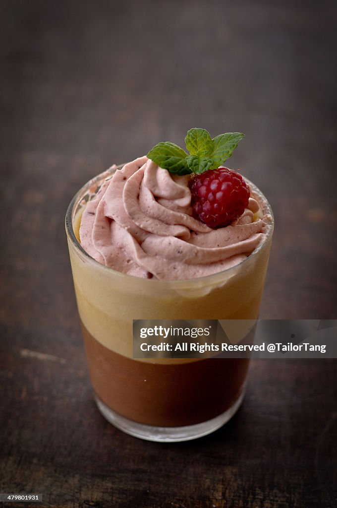 Chocolate and Caramel Mousse topped with Raspberry