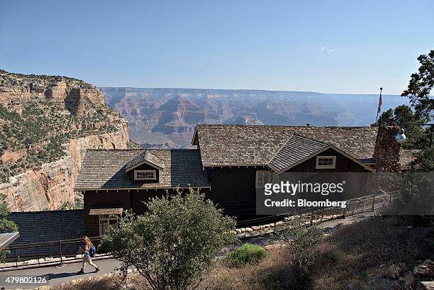 Visitor walks behind the Kolb Studio in the Grand Canyon Village area of Grand Canyon National Park in Grand Canyon, Arizona, U.S., on Thursday, June...