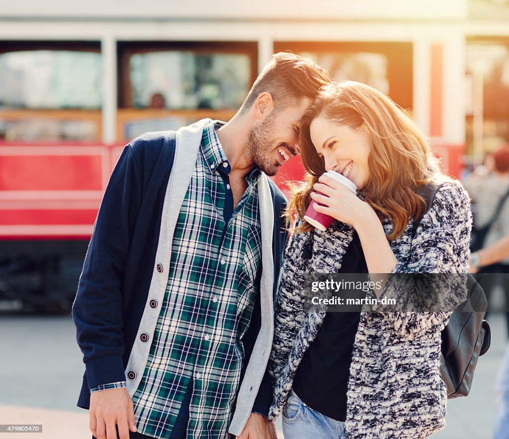 Happy couple flirting outside