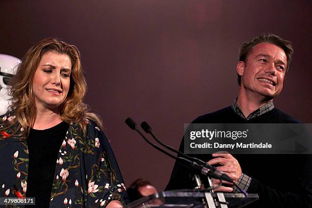 Penny Mordaunt MP and Graeme Le Saux watch as Penny belly flops on ITV's 'Splash!' at the annual Ultimate News Quiz at the London Film Museum on...