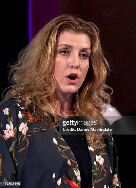 Penny Mordaunt MP talks at the annual Ultimate News Quiz at the London Film Museum on March 20, 2014 in London, England.