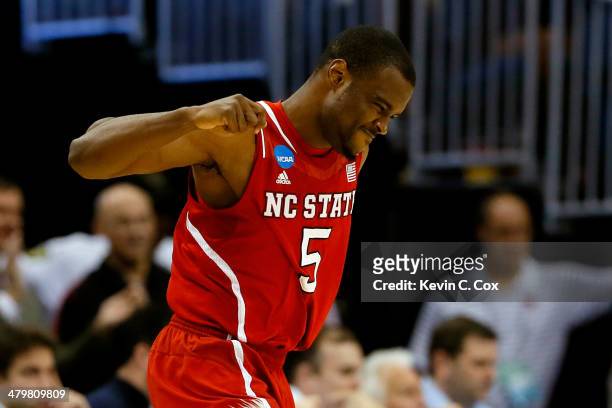 Desmond Lee of the North Carolina State Wolfpack celebrates a three point basket in the second half against the Saint Louis Billikens during the...