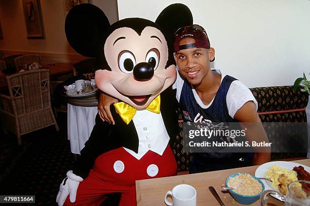 Reggie Miller of the 1996 United States Mens Olympic Basketball Team poses for a picture with Mikey Mouse circa 1996 in Atlanta, GA. NOTE TO USER:...