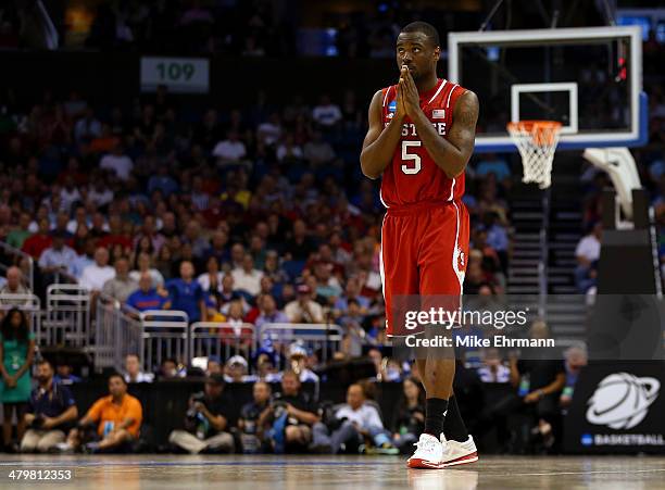 Desmond Lee of the North Carolina State Wolfpack reacts in the second half against the Saint Louis Billikens during the second round of the 2014 NCAA...