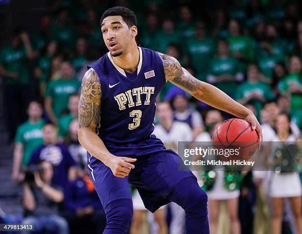 Cameron Wright of the Pittsburgh Panthers brings the ball up court during the game against the Notre Dame Fighting Irish at Purcel Pavilion on March...