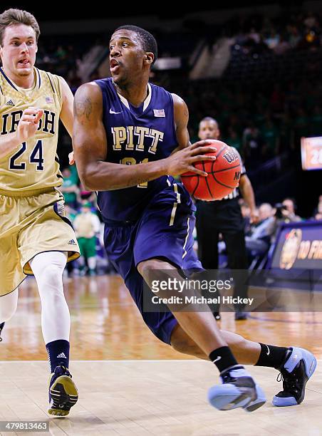 Lamar Patterson of the Pittsburgh Panthers drives to the basket against Pat Connaughton of the Notre Dame Fighting Irish at Purcel Pavilion on March...