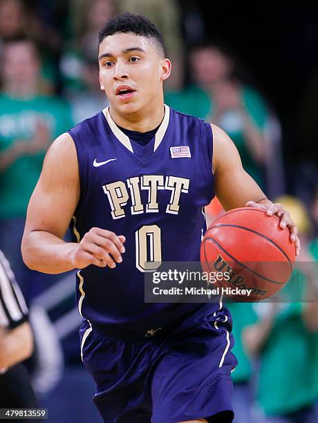 James Robinson of the Pittsburgh Panthers brings the ball up court during the game against the Notre Dame Fighting Irish at Purcel Pavilion on March...
