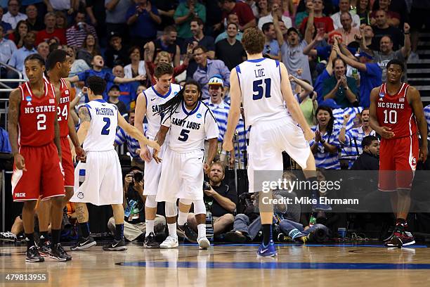 Jordair Jett of the Saint Louis Billikens celebrates a basket in the second half to tie the game against the North Carolina State Wolfpack during the...