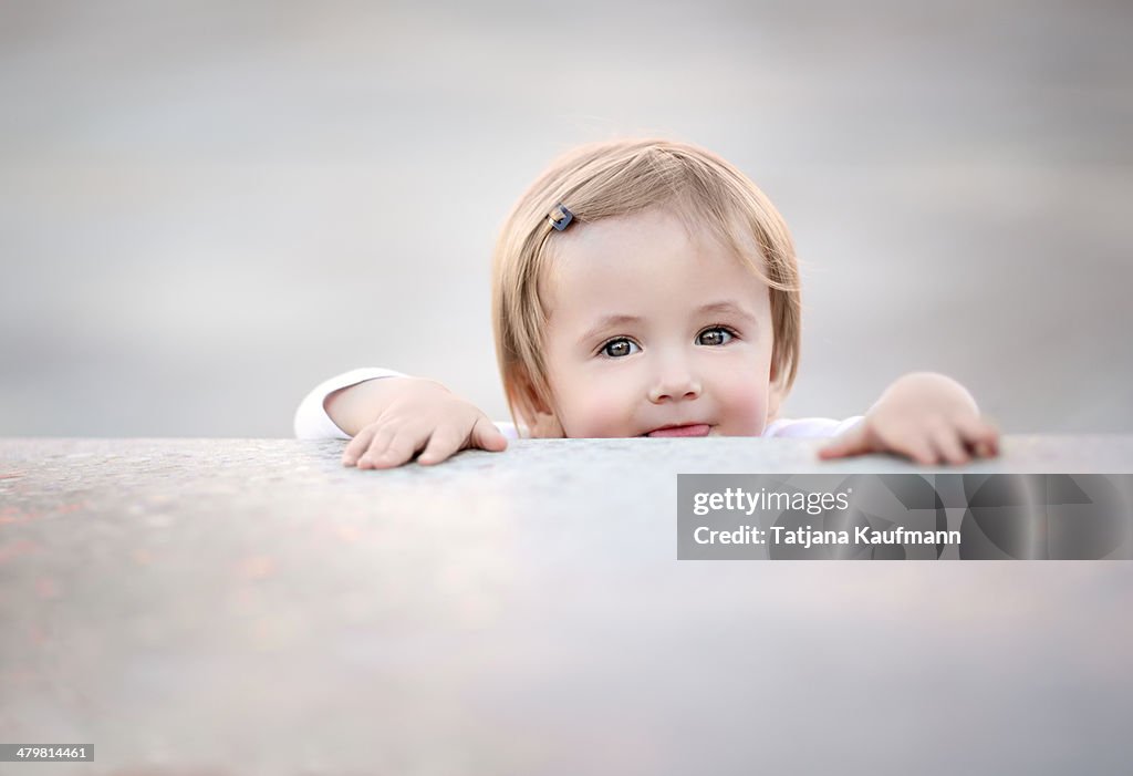 Toddler playing Hide and Seek