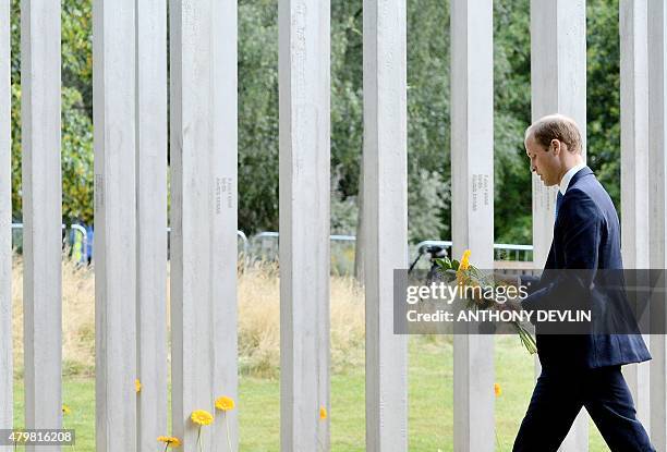 Britain's Prince William, Duke of Cambridge, lays flowers at the 7/7 memorial in London's Hyde Park on July 7 in memory of the 52 people killed...