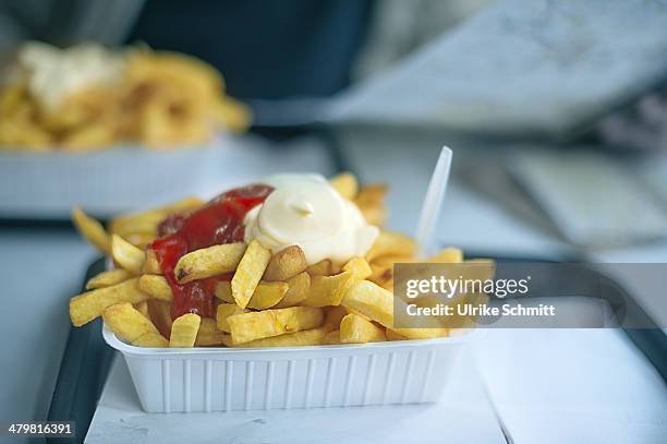 french fries with mayonnaise and ketchup - frites stockfoto's en -beelden