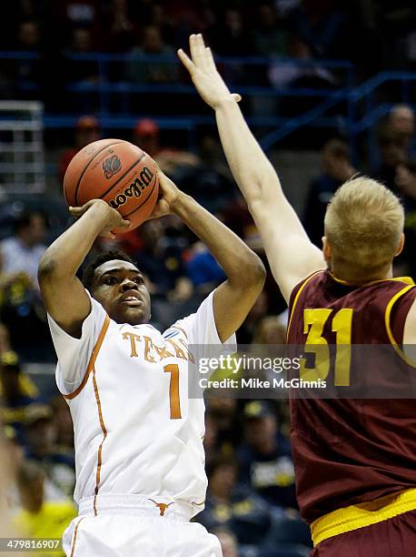 Isaiah Taylor of the Texas Longhorns shoots over Jonathan Gilling of the Arizona State Sun Devils in the first half during the second round of the...