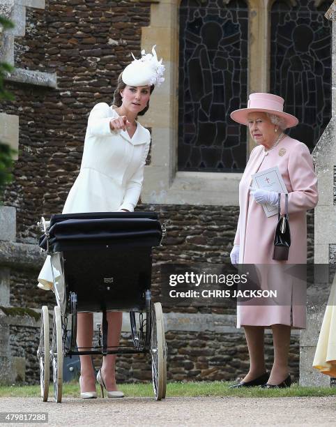 Catherine, Duchess of Cambridge talks to Britain's Queen Elizabeth II after the christening of Princess Charlotte of Cambridge at St. Mary Magdalene...