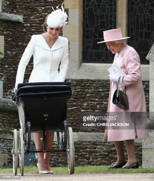 Catherine, Duchess of Cambridge talks to Britain's Queen Elizabeth II after the christening of Princess Charlotte of Cambridge at St. Mary Magdalene...