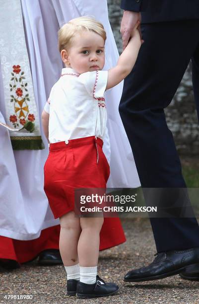 Prince George of Cambridge leaves his sister Charlotte's christening at St. Mary Magdalene Church in Sandringham, England, on July 5, 2015. Britain's...