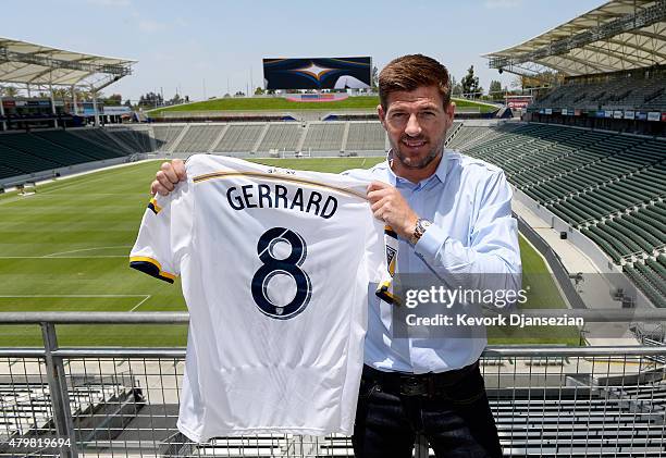 New Los Angeles Galaxy midfielder Steven Gerrard poses with his jersey after a news conference on July 7, 2015 at StubHub Center in Carson,...