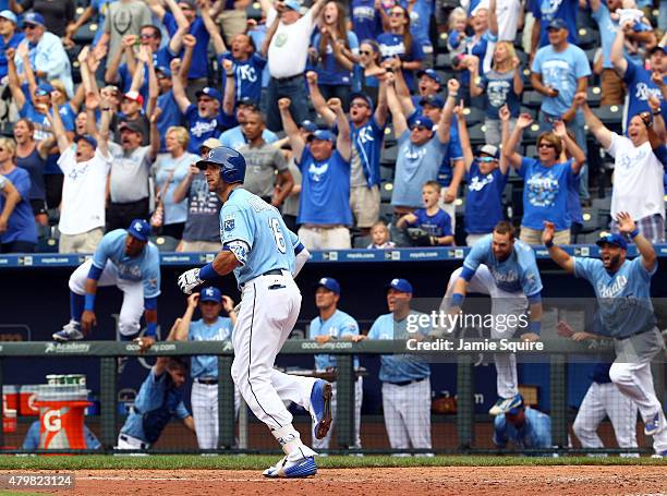 Paulo Orlando of the Kansas City Royals watchs the ball fly over the wall as he hits a walk-off grand slam in the bottom of the 9th inning during...